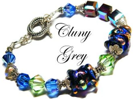 Handmade Swarovski bracelet with dichroic beads and sterling silver.