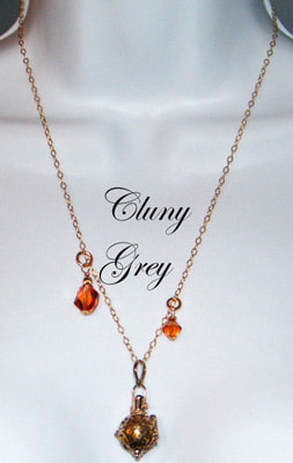 Bezel-set gemstone and Swarovski crystals necklace with gold.