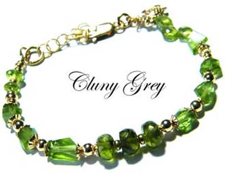 Peridot bracelet with yellow gold beads.